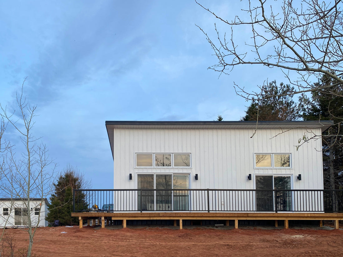 2 bedroom lean cottage built in Oregon, white exterior siding and large windows