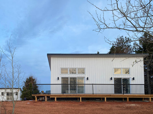 2 bedroom lean cottage built in Oregon, white exterior siding and large windows