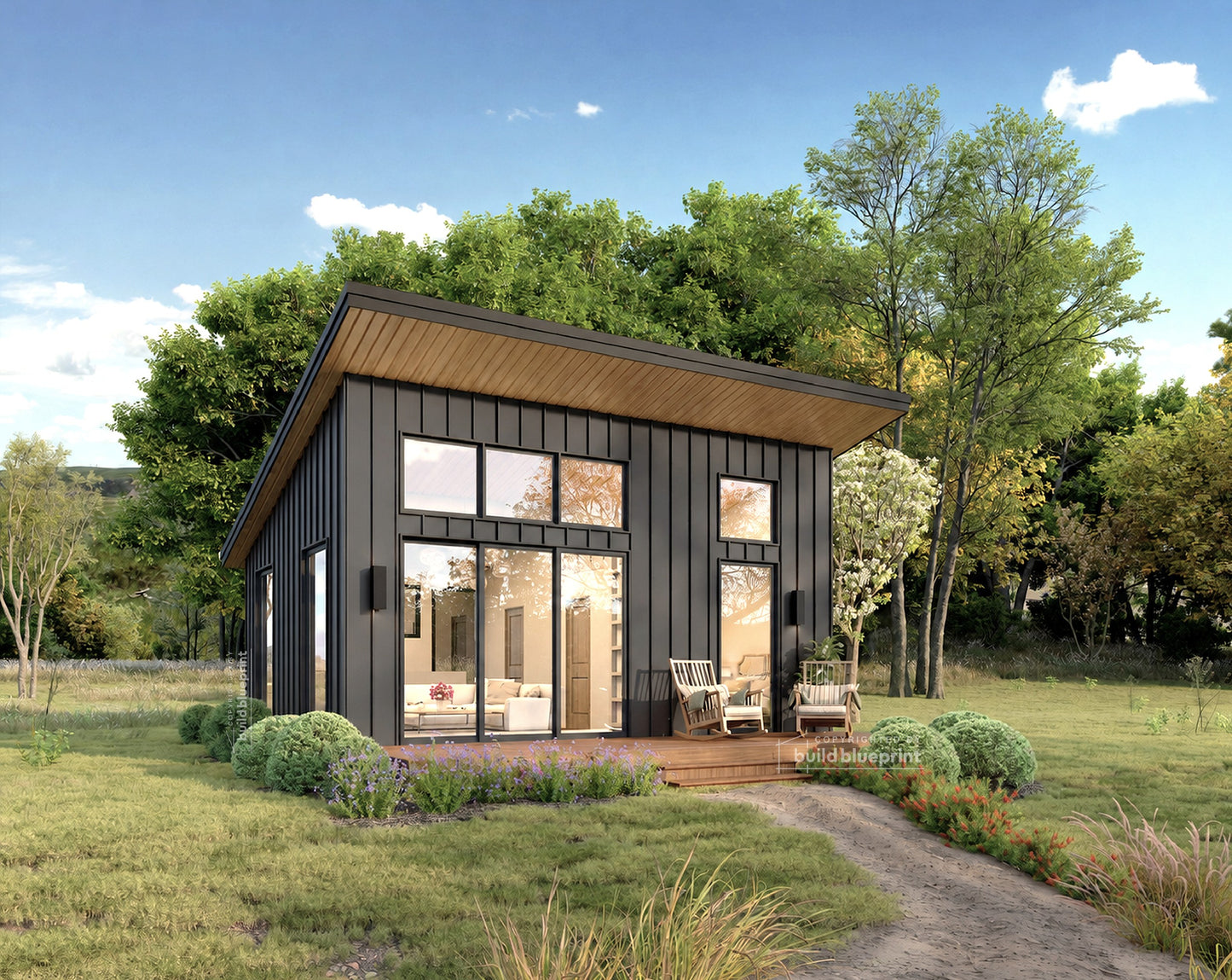 A modern single-story cabin with dark charcoal vertical siding, large wood-look overhangs, and expansive glass windows, shown on a landscaped lawn with trees and a blue sky.