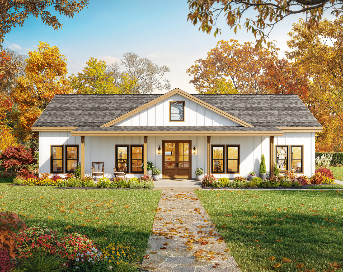A white single-story farmhouse-style house with a gray shingled roof, stone walkway, landscaped lawn, and autumn trees in the background.
